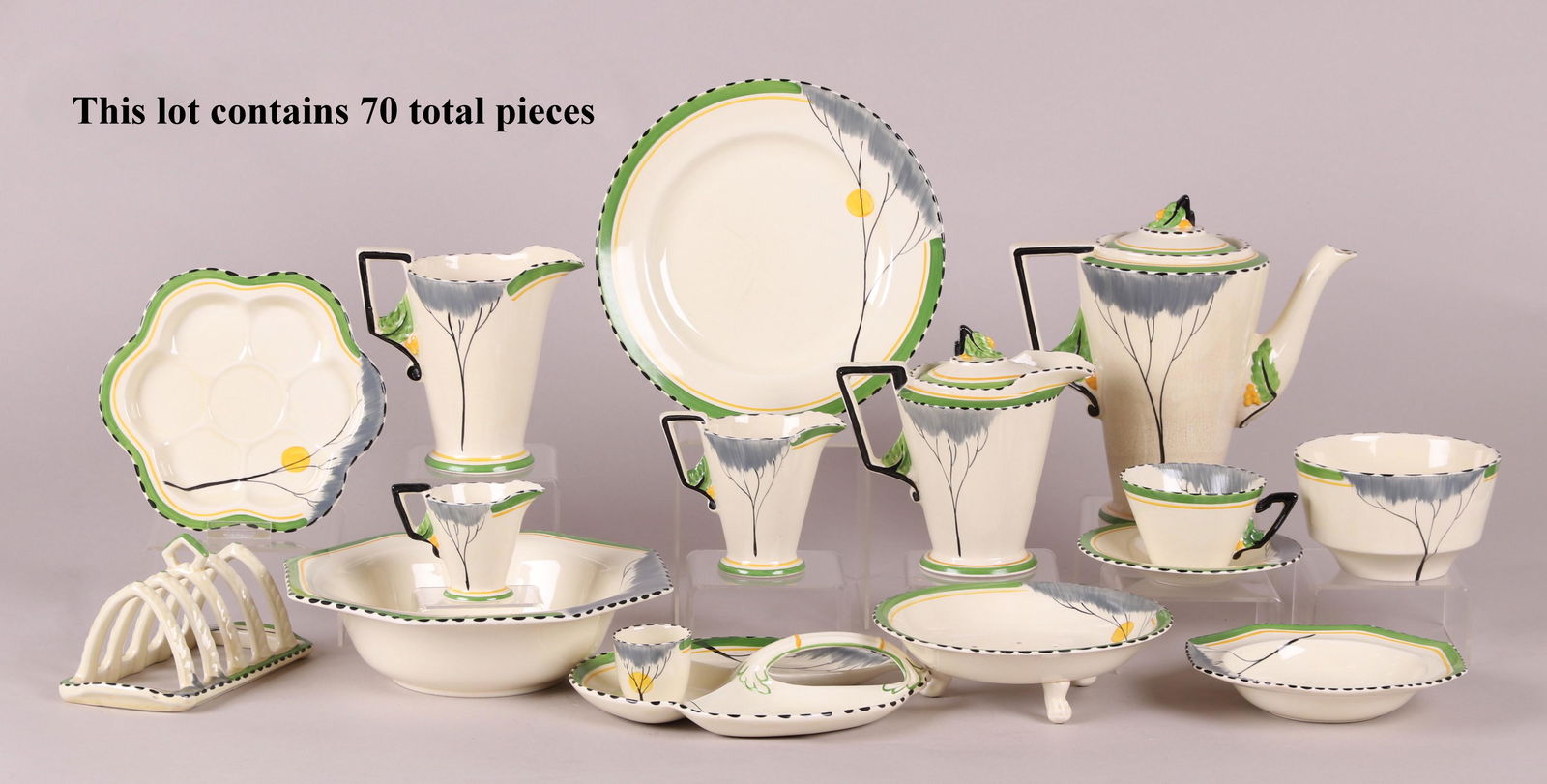 A Burleigh pottery Art Deco Dinnerware: 70 pieces, in the Zenith line and the "Dawn" pattern. Comprising: two 6" plates, eleven 9" plates, twelve 7" plates, a 9" divided plate, twelve 5 3/4" saucers, six 6 3/4" octagonal bowls, a 7" long to