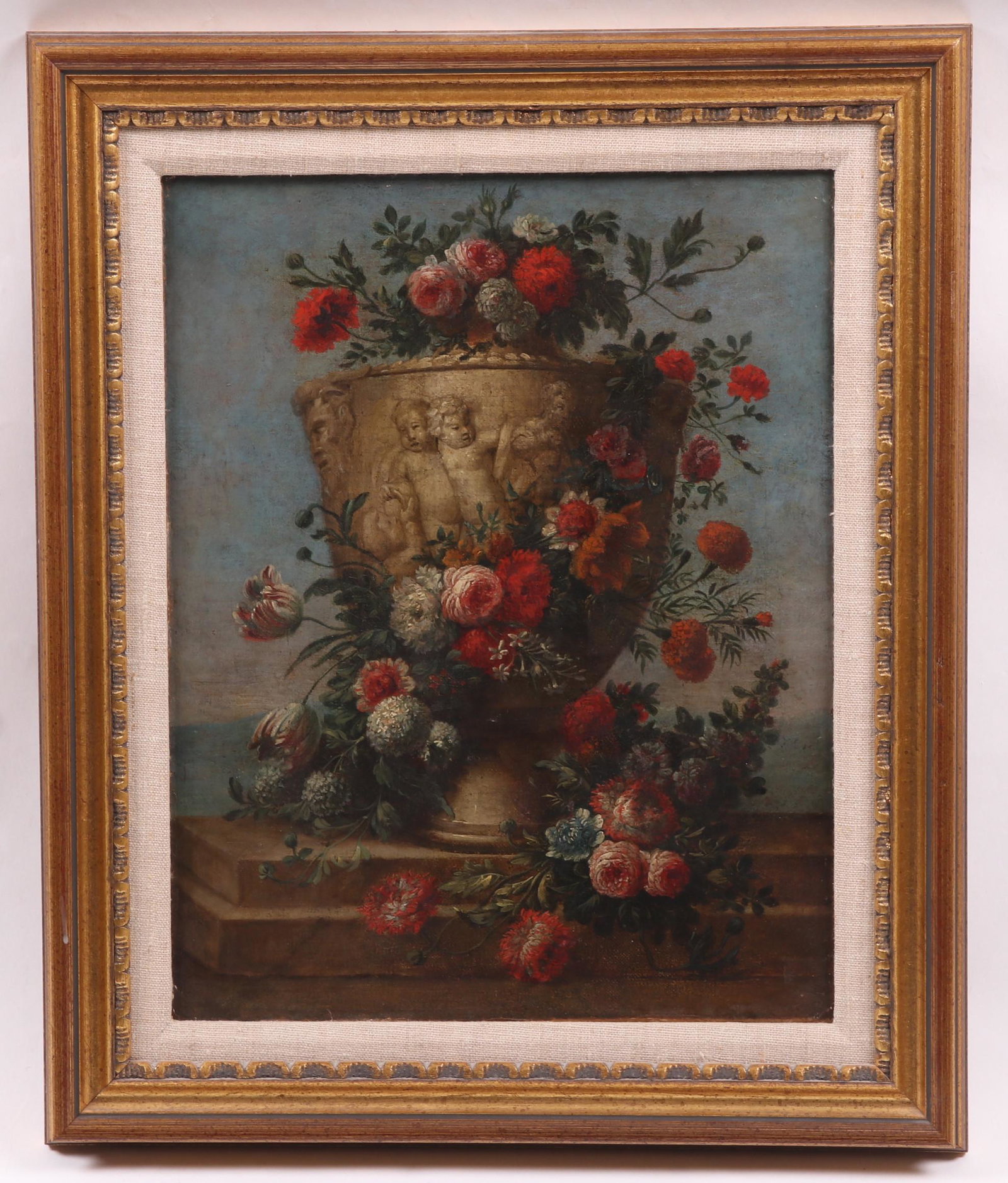 Continental School, 19th c. Oil on Canvas: A still life with urn and flowers, unsigned. Dimensions: 16" x 13", the frame 21" x 17".