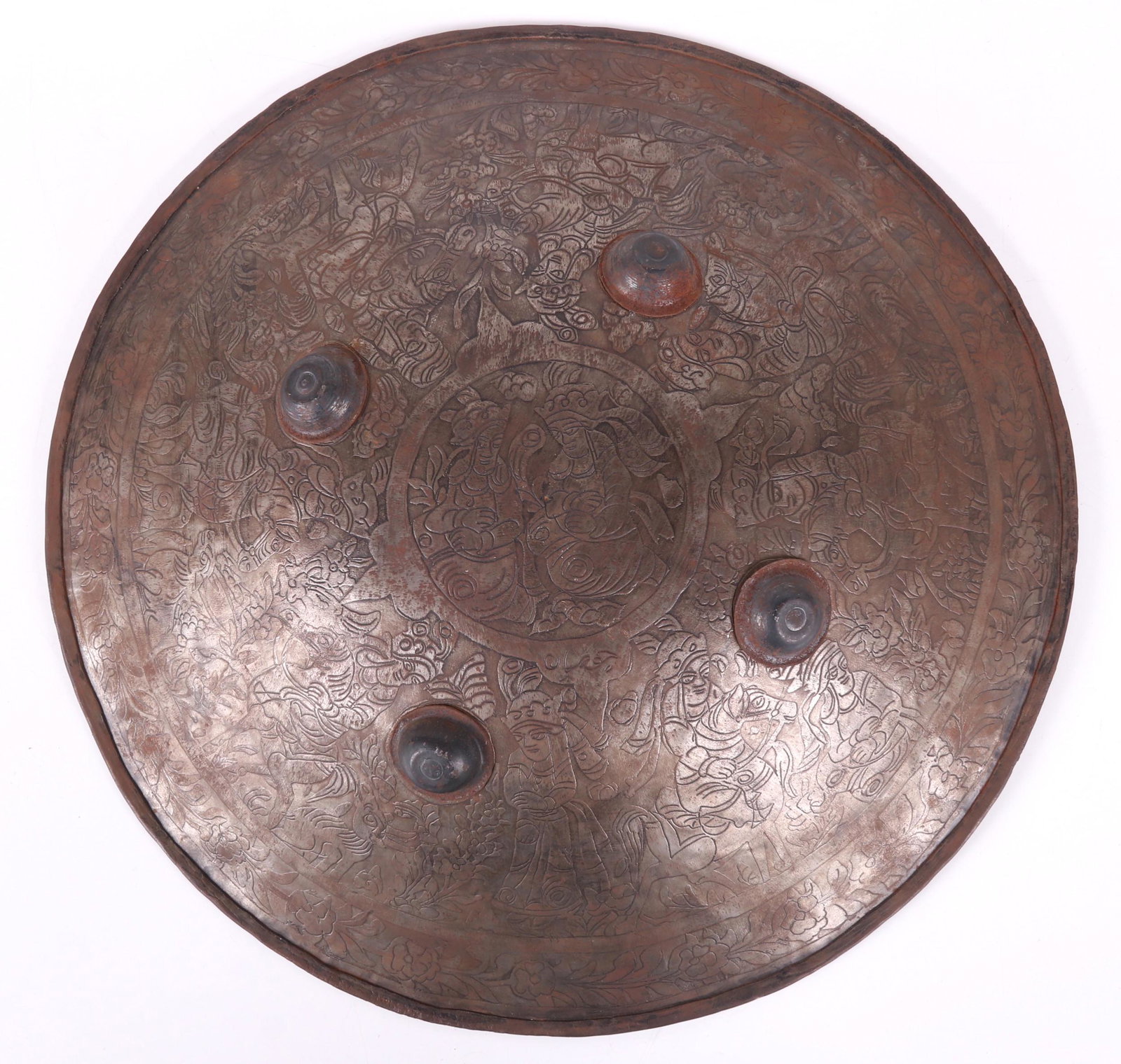 An Indo-Persian Steel Shield: 19th century, of typical form and decorated with many figures. Dimensions: 19" in diameter. Provenance: From a Main Line Estate
