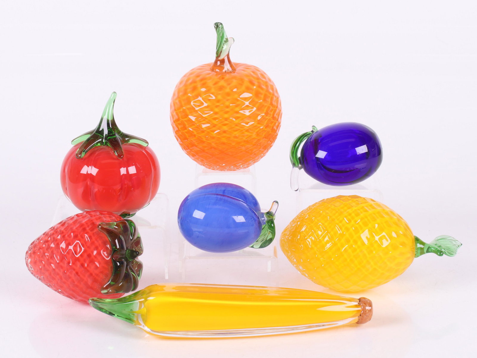 Seven Pieces of Beranek Glass Fruit: 20th century, a banana, lemon, orange, two plums, a strawberry and a tomato. One with sticker as pictured. Dimensions: From 3 1/2" x 2 1/2" x 2" to 9" x 2" x 2".