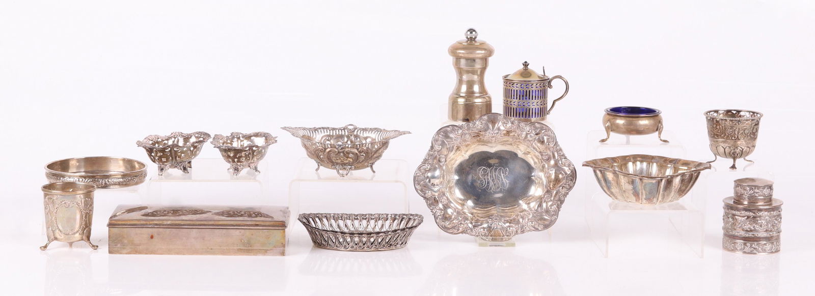 A Group of Estate Sterling Silver, Small Articles: Comprising: two footed toothpicks, a repousse dish by Whiting, a Reed and Barton candy dish in the Windsor pattern, a pair of pierced nut dishes by Alvin, a master nut dish by Gorham, a Mustard pot wi