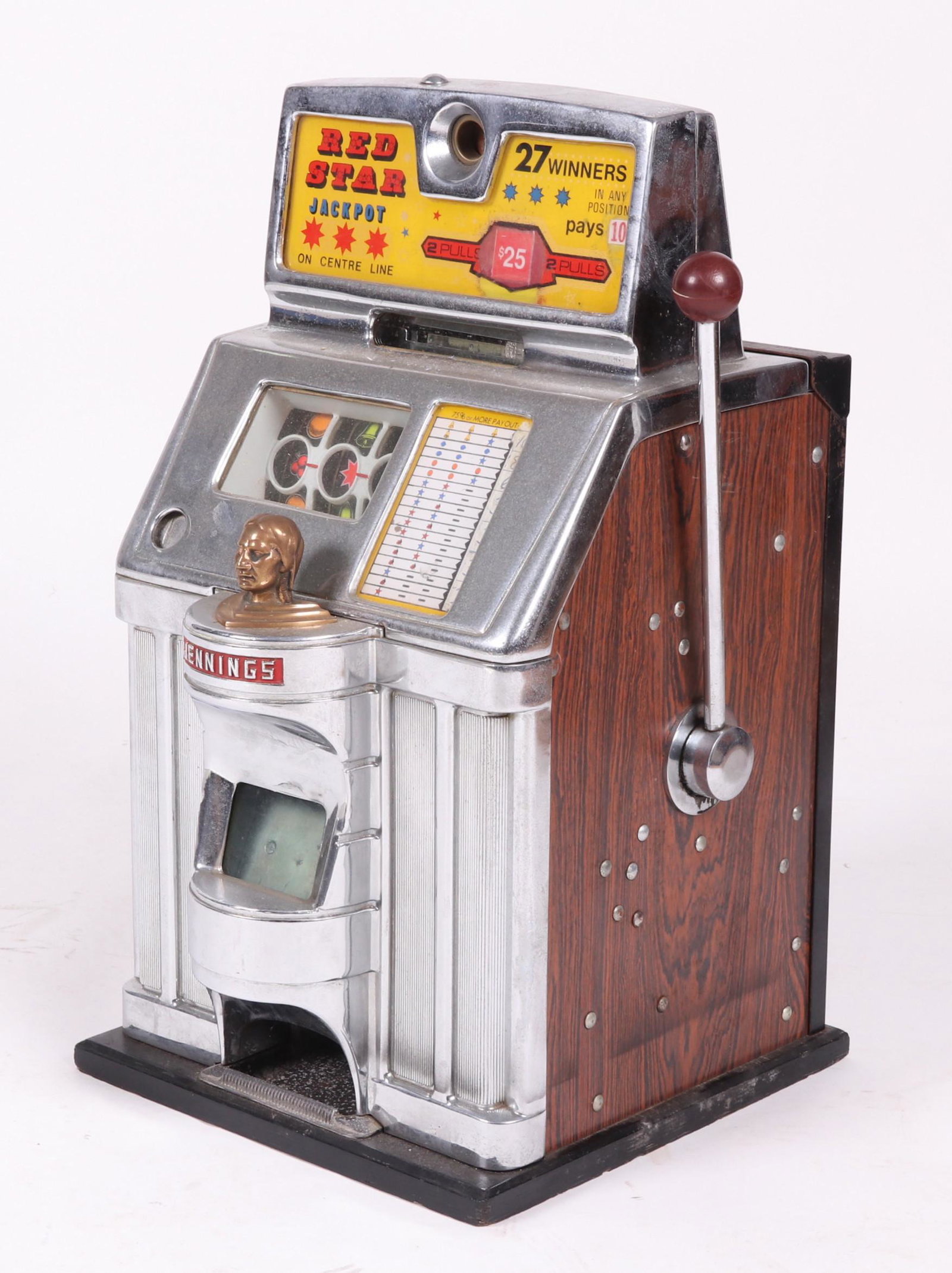 Jennings Red Star Jackpot Slot Machine: In chrome and wood grain, first half of the 20th century. Dimensions: 17" x 17", the height is 28". Provenance: From a local estate.