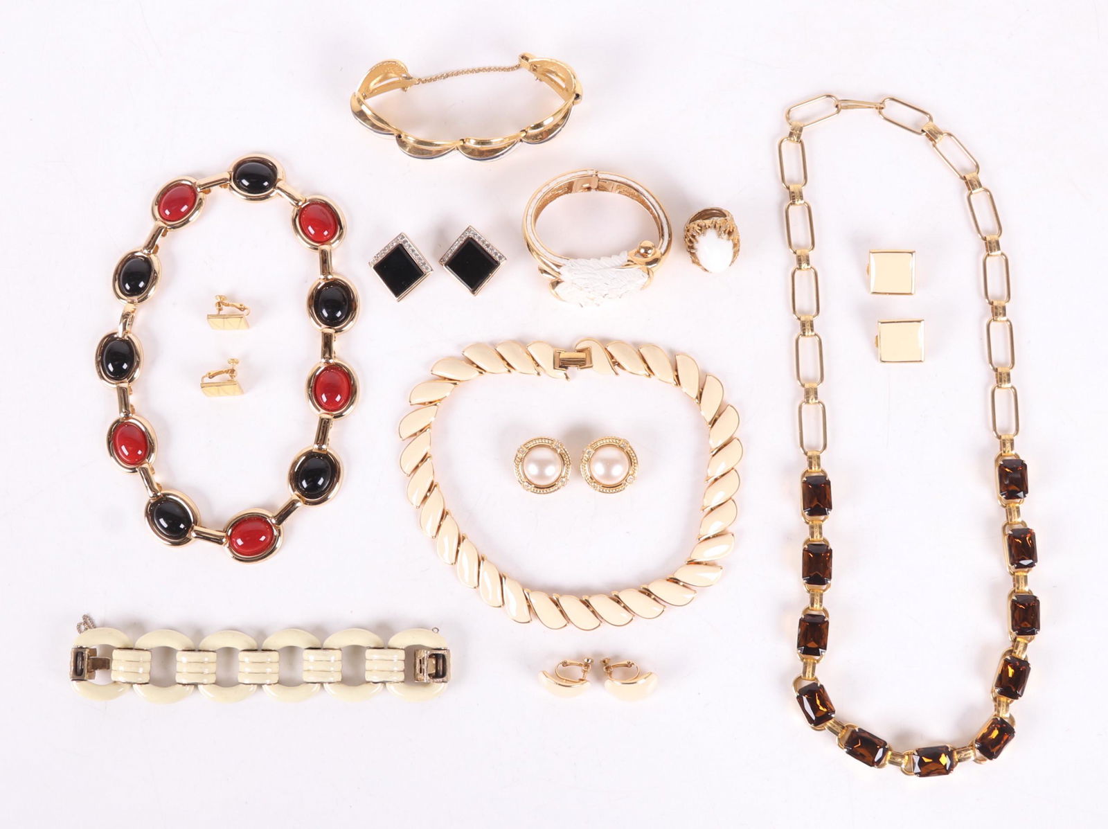 A Group of Vintage Costume Jewelry: Three bracelets, three necklaces, a ring, and five pairs of earrings. Makers include Trifari, Napier, Joan Rivers, and Panetta. Dimensions: From 3/4" x 1/4" to 28" long.