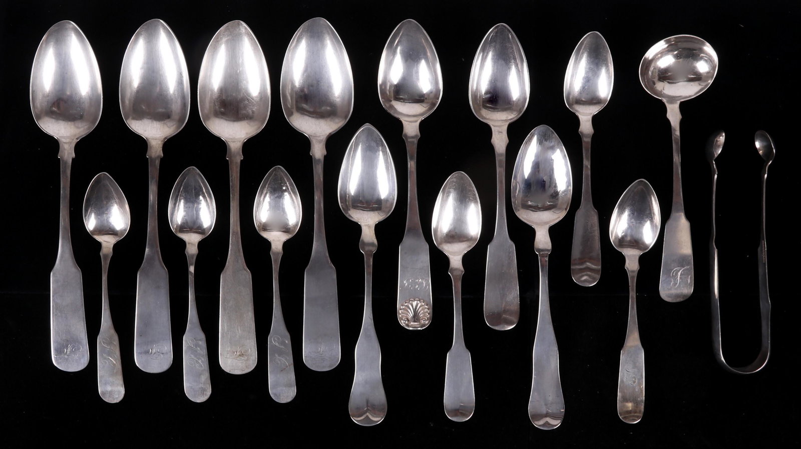 Assortment of Boston Coin Silver Spoons: Comprising: four serving spoons by Davis, Watson and Co. c. 1820, four teaspoons by J.J. Low and Co., two tablespoons by Currier and Trott, a tablespoon and two teaspoons by J.B. Jones and Co., anothe