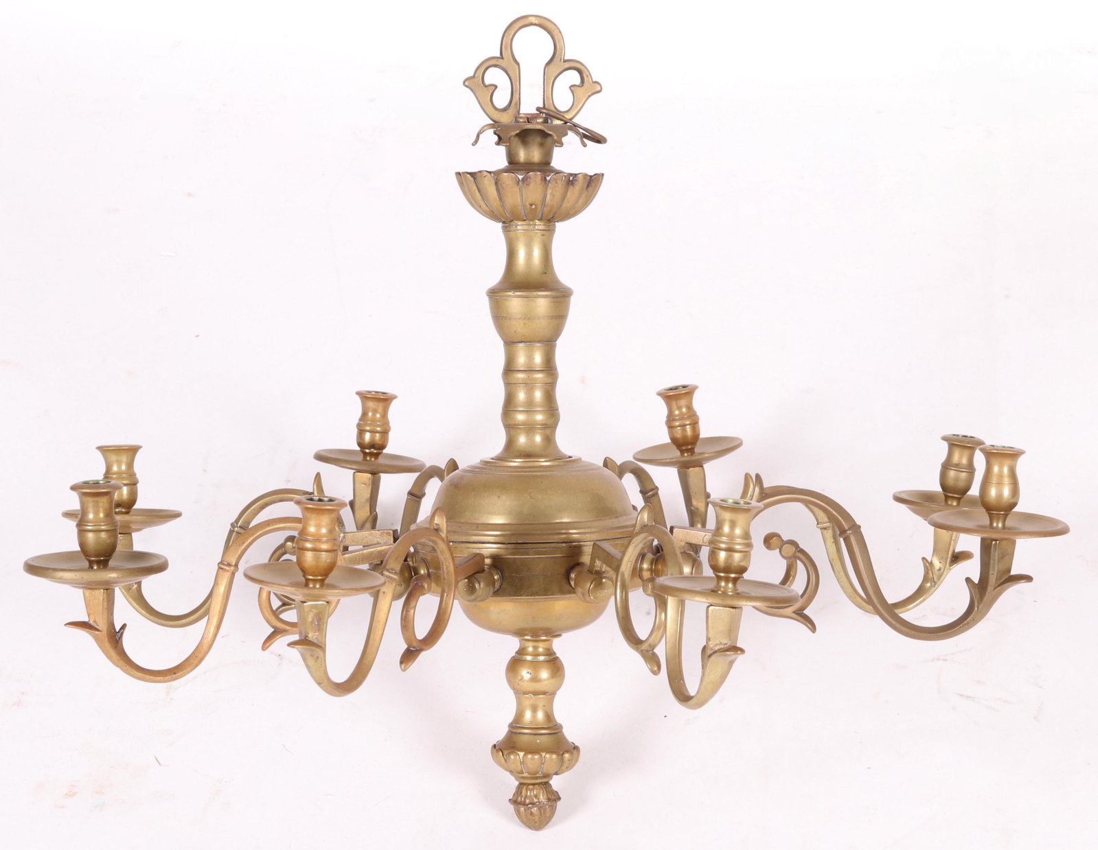 A 19th Century Dutch Brass Chandelier: Of typical form with eight scrolled arms and a body with a turned shaft and acorn pendant. Dimensions: 29" in diameter. 24" tall. Provenance: From a Main Line Estate