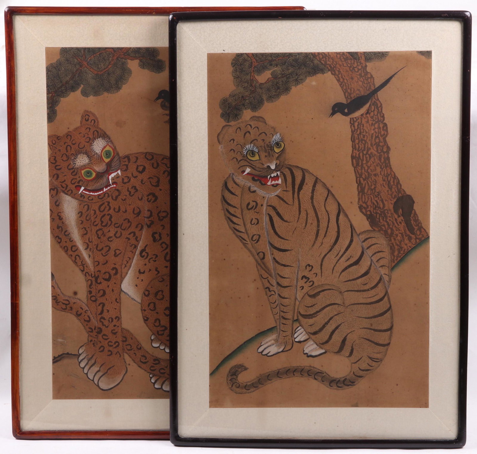 Korean School, 19th Century, Two Paintings: One depicting a tiger and magpie, the other a leopard and magpie, both watercolor on paper. Dimensions: Each frame is 36" x 24". Provenance: From a local estate.