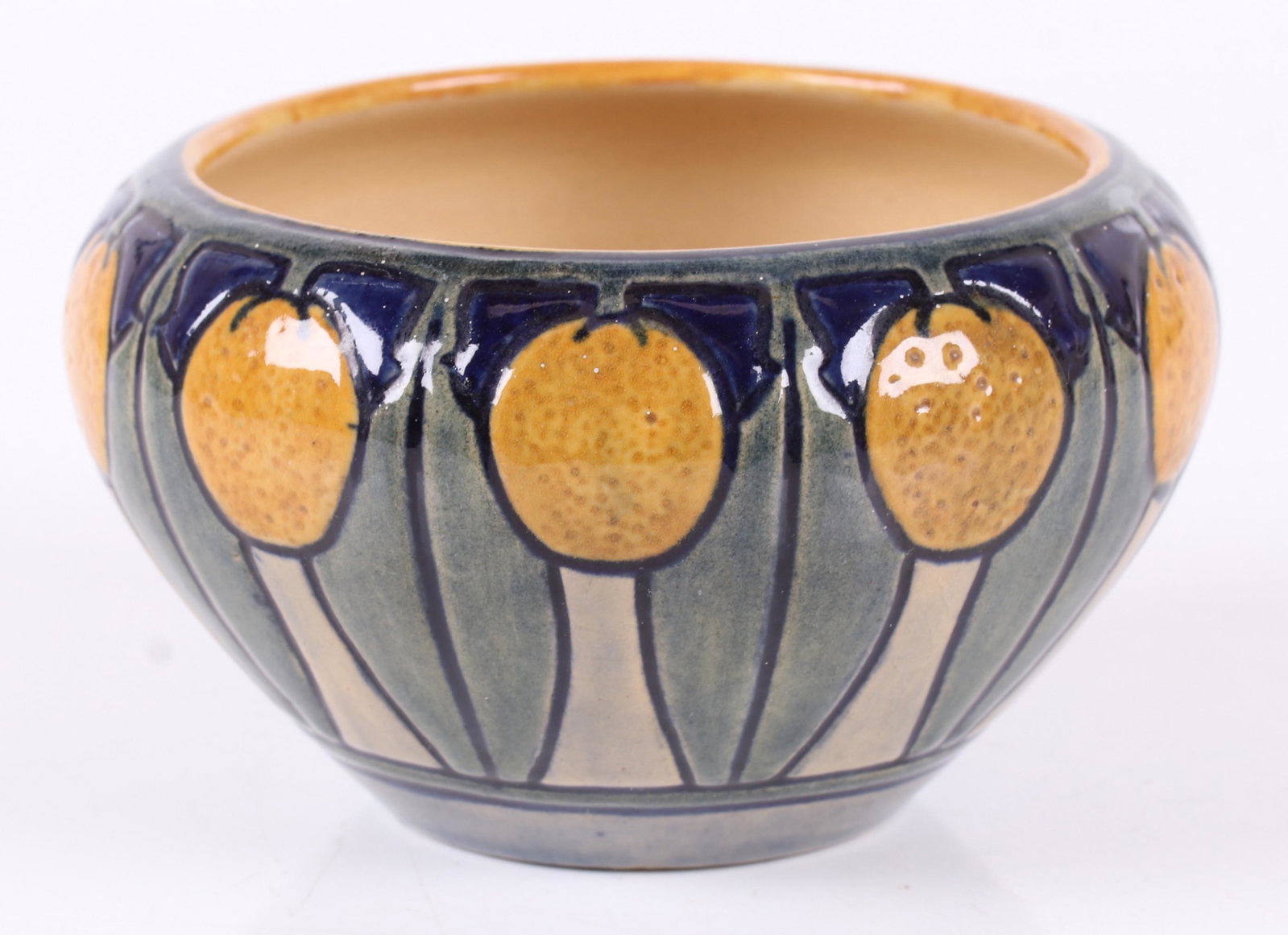 A Newcomb College Pottery Vase: With repeated floral decoration. Marked at the foot as pictured. Dimensions: 5 1/2 diameter, 3 1/4" tall.