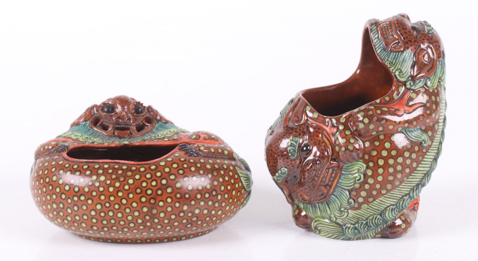 Two Chinese Porcelain Brush Washers: Both 20th century/modern, each in the form of a Foo Dog, Qianlong mark. Dimensions: 4 1/2" x 5 1/2" and 3 1/2" x 4", the heights are 3" and 5". Provenance: From a Main Line Collection.
