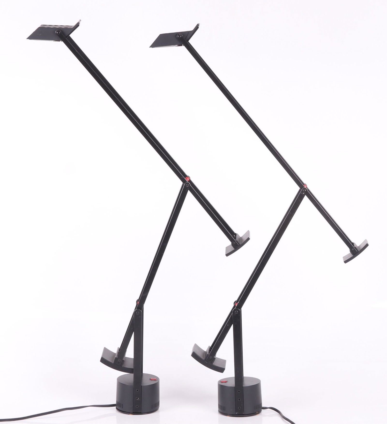 Two Lamps, Richard Sapper, Tizio: A pair of black cantilever form lamps, designed for Archimede. Dimensions: 4 1/2" in diameter, the height is 45" tall. Provenance: From a local estate.