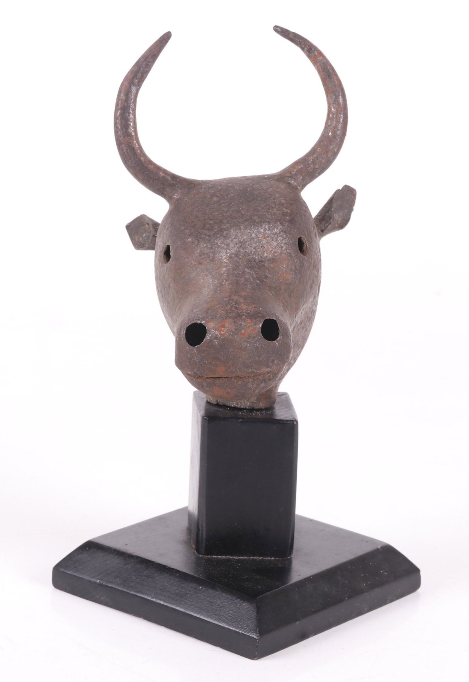 A Persian Steel Staff Terminal: In the form of a horned animal on a later wooden plinth. Dimensions: 4 1/2" x 4 3/4", overall height 9". Provenance: From a Main Line Estate