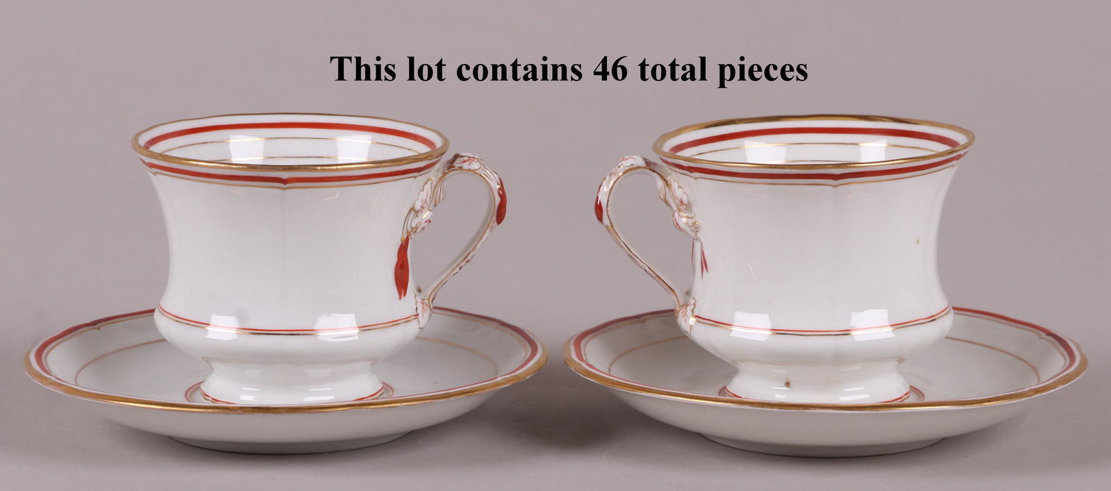 KPM Porcelain Coffee Cups and Saucers: Twenty four cups and twenty two saucers. 19th century, each with a gilt and crimson border and marked as pictured. Part of a larger service we are selling in this pattern, please check the other lots