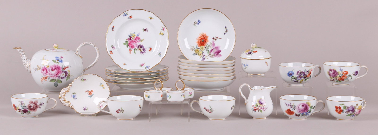 A Meissen Porcelain Dessert Service: 19th century, each with typical hand painted floral decoration, underglaze blue mark as pictured. Comprising: Two 3 3/4" x 2" x 2" double salts, a 3 1/2" tall creamer, a 3 1/4" covered sugar, a 5 1/4"