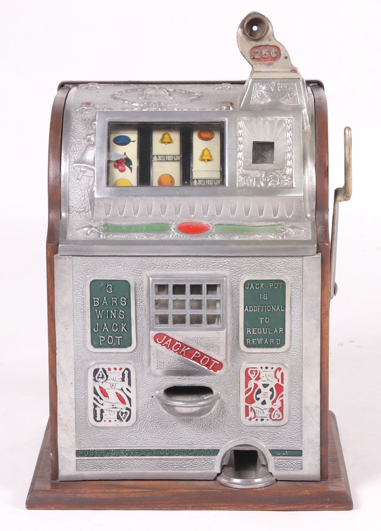 A Mills 25 Cent Slot Machine: From the first half of the 20th century, with oak sides and back. Dimensions: 16" x 15", 25 1/2" tall.