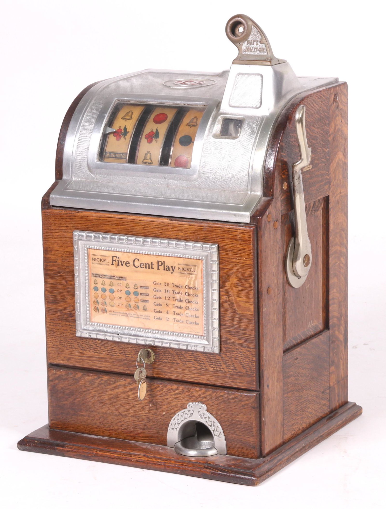 A Jennings Five Cent Slot Machine: Oak and chrome, circa 1930. Dimensions: 15" x 14 1/2", the height is 26".