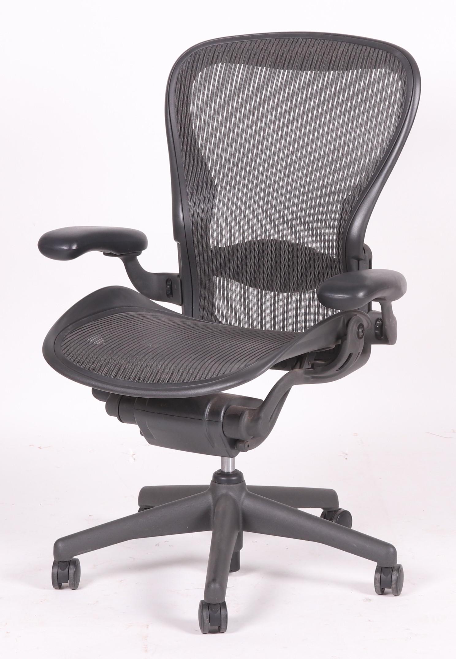 Aeron Chair by Herman Miller: Designed by Don Chadwick and Bill Stumpf for Herman Miller, labeled as pictured. Dimensions: 28" x 21", the height is 42".