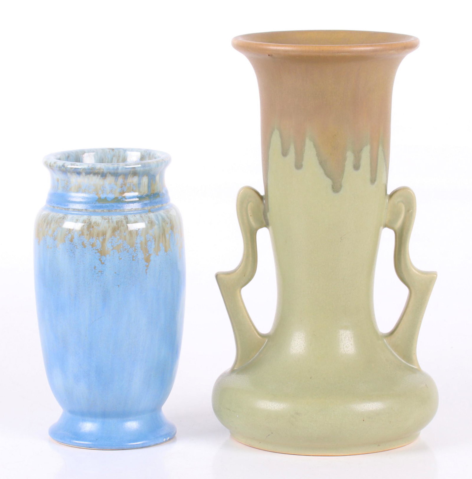 Roseville Pottery, Carnelian Drip, Tourmaline: A green Carnelian drip vase with handles and a blue crystalline glazed vase in the Tourmaline pattern. The Carnelian example is marked as pictured. Dimensions: 4" and 6" in diameter, the heights are 7