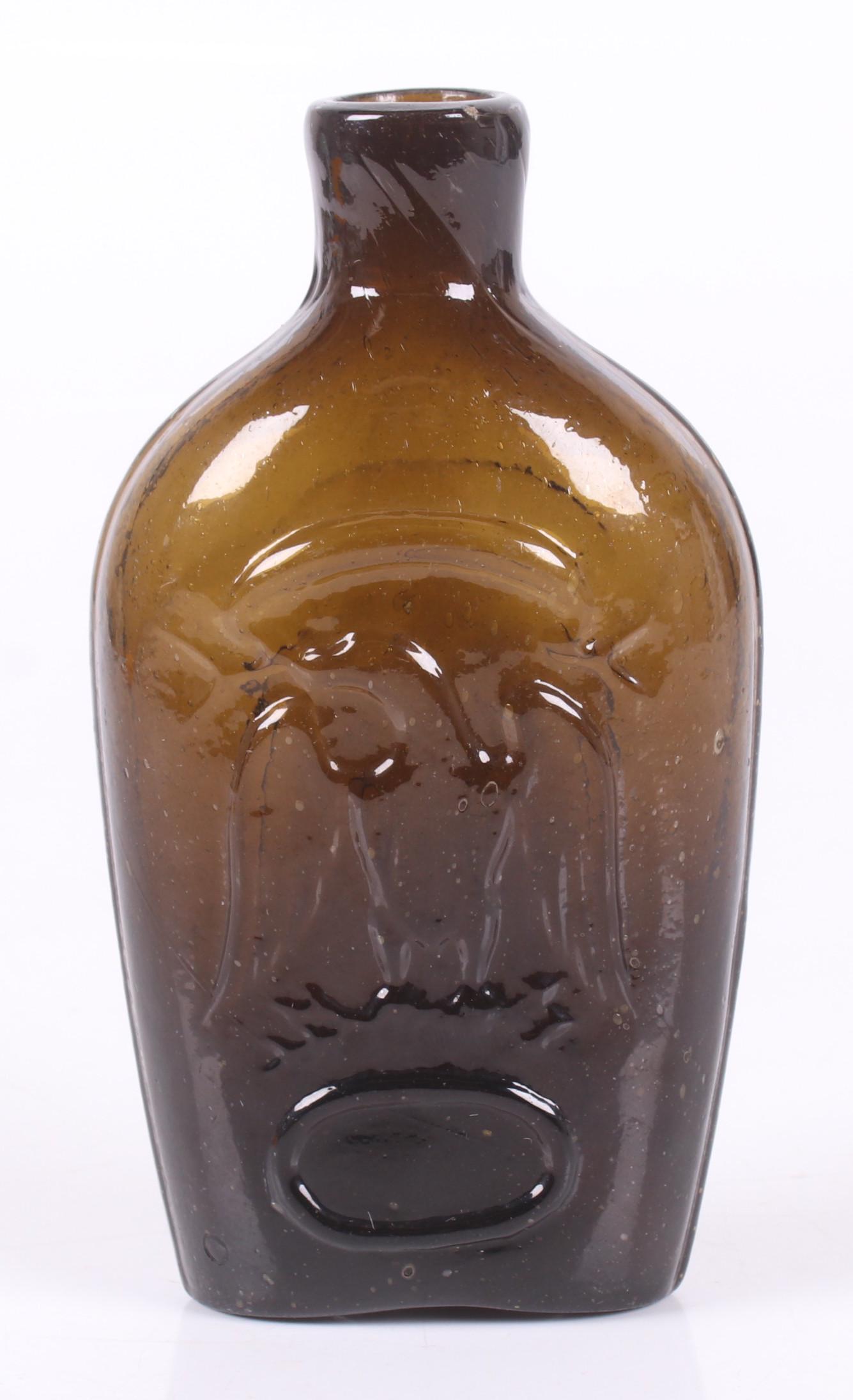 A Pittsburgh Historical Glass Flask: Early 19th century, decorated with an eagle at each side. Dimensions: 3 1/2" x 2", the height is 6". Provenance: From a Pittsburgh estate.