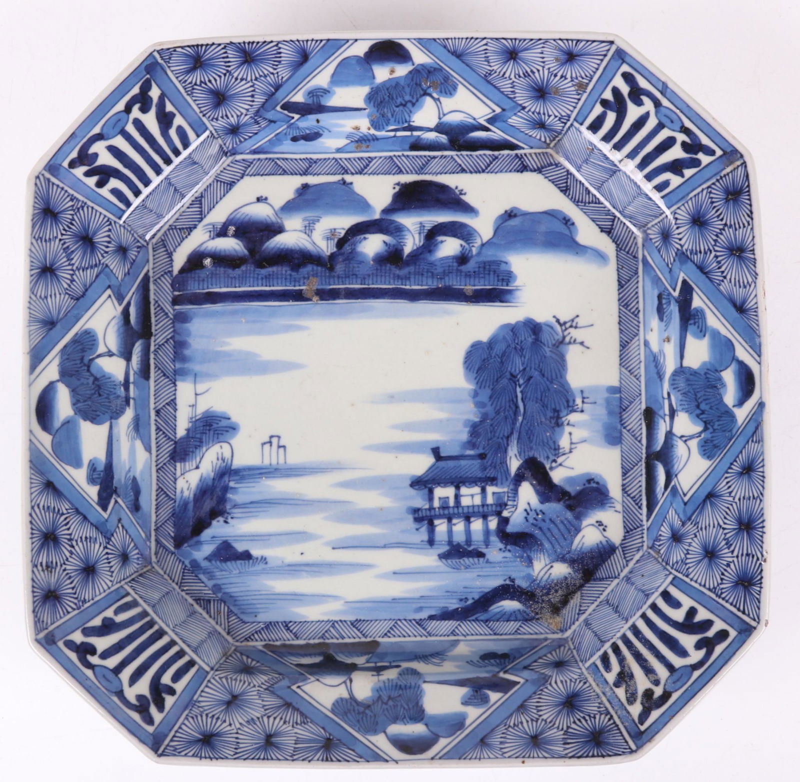 A Japanese Blue and White Porcelain Dish: A large square dish with cut corners and typical decoration. Marked as pictured. 19th century. Dimensions: 12 3/4" x 12 3/4", the height is 2". Provenance: From a Pittsburgh estate.