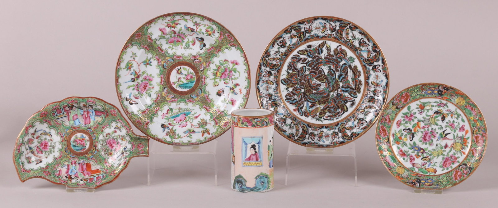 Five Pieces of Chinese Export Porcelain: All 19th century, comprising: a Rose Mandarin brush pot, a famille rose plate, a Thousand Butterflies pattern plate, a Rose Medallion plate and a leaf form Rose Medallion dish. Dimensions: From 6 1/4"