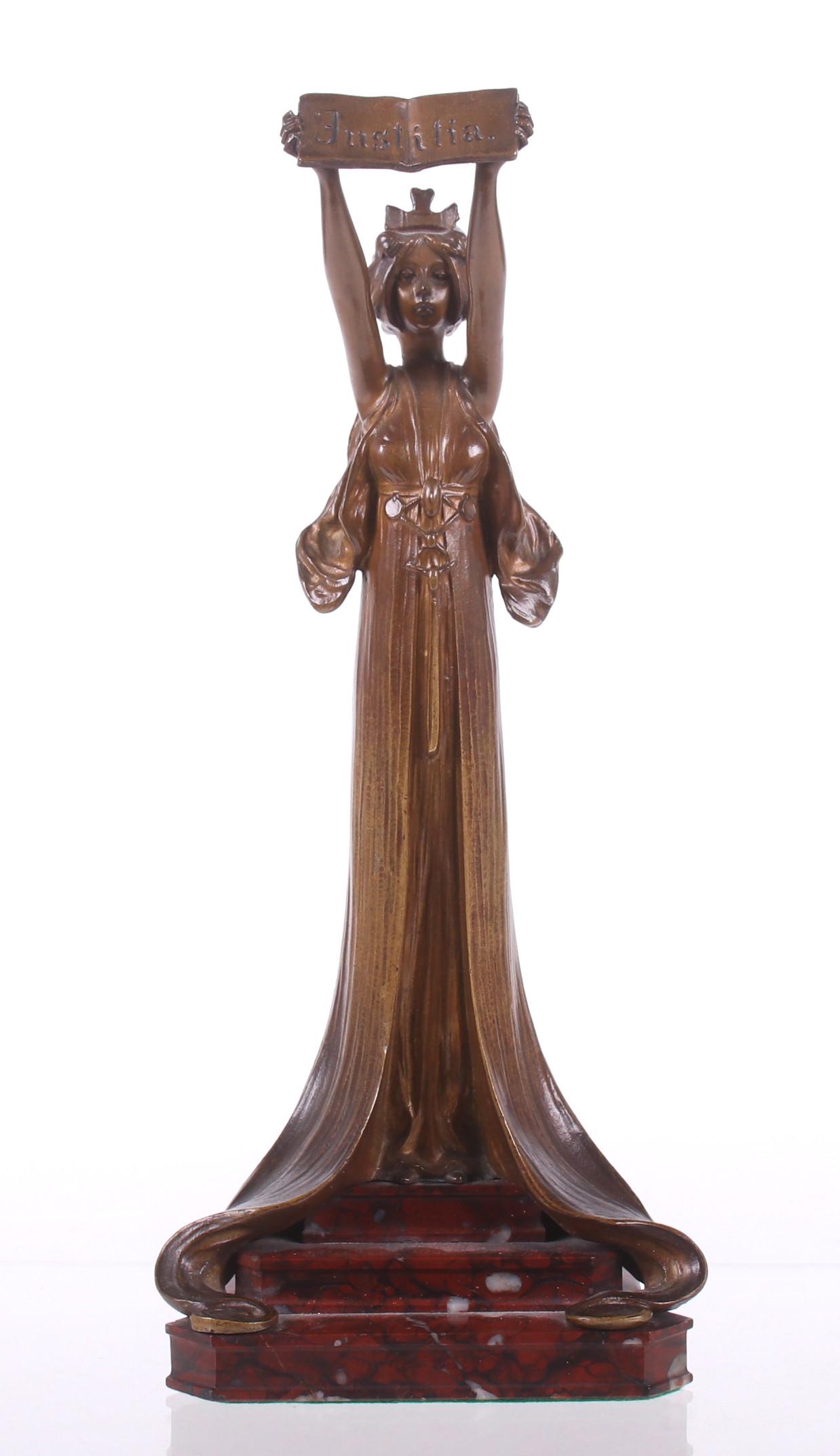 A French Bronze Depicting Justitia: Circa 1900, on a rouge marble base and signed "Mausch Paris". Dimensions: 5" x 3 1/2", the height is 11 1/2". Provenance: From a Pittsburgh estate.