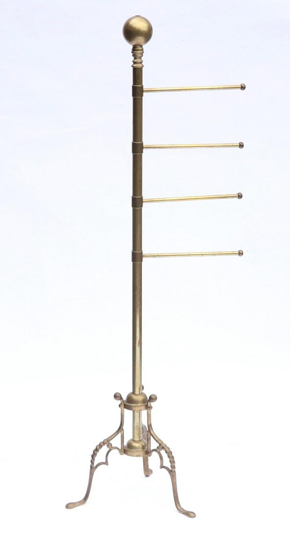 A Brass Coat Rack: With a tripod base, four straight arms and a ball finial. Dimensions: 49" tall. Provenance: From a local collection.
