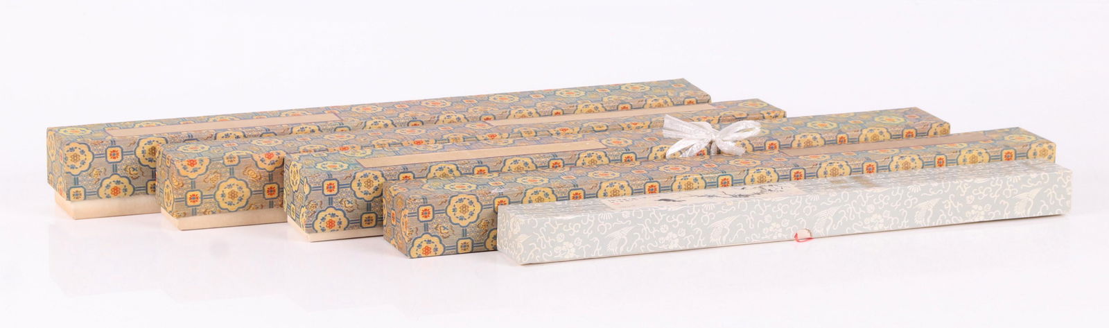 Eight 20th Century Chinese Scroll Paintings: Seven are watercolor on paper, the last is a printed textile. Subjects include birds and flowers. Dimensions: The boxes range from 18 3/4" x 2" to 1 1/2" to 22" x 2 1/2" x 2 1/4". The scrolls from 22