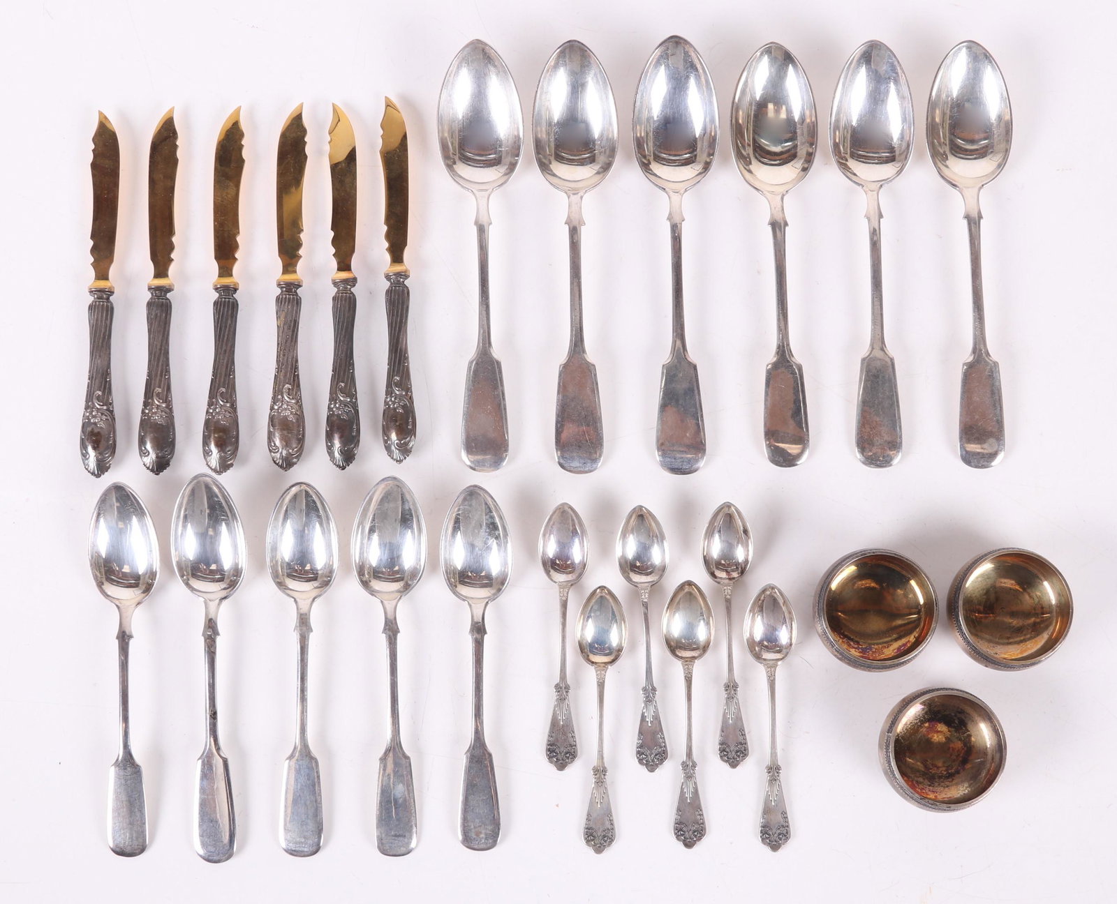 A Group of Russian Silver Flatware: A set of six tablespoons and five teaspoons in a matching pattern and marked 84 and a dessert set with six spoons and six knives (loaded handles and plated blades). Also in the lot is a set of three .
