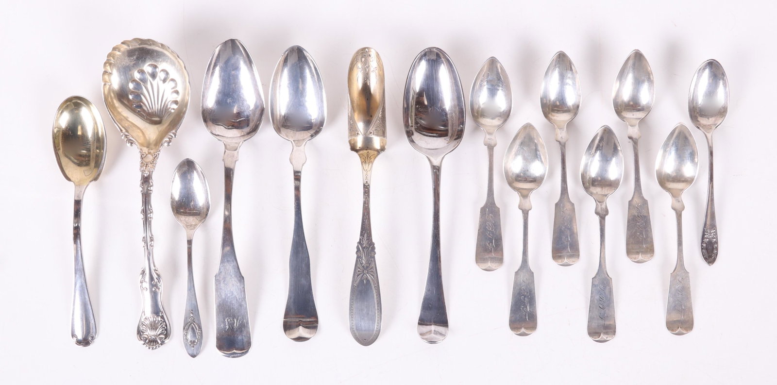A Group of Estate Sterling Flatware: Comprising: a London spoon hallmarked for the year 1760 and the maker EC over TH, a set of six sterling teaspoons marked for H.B. & H.M. BACON ( Milwaukee c. 1860) , two 20th century American sterling