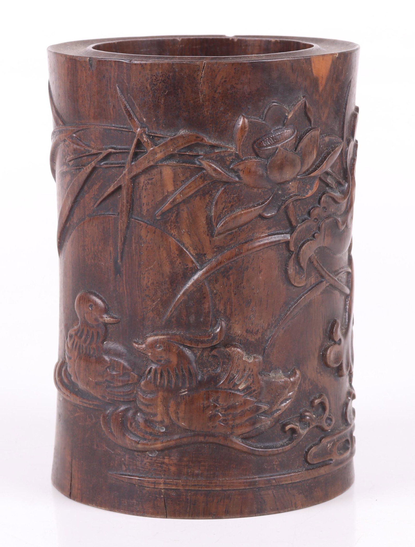 A Chinese Zitan Brush Pot: With carved duck and lotus decoration. Dimensions: 4 1/2" in diameter, 6 1/8" tall. Provenance: From a PA estate.
