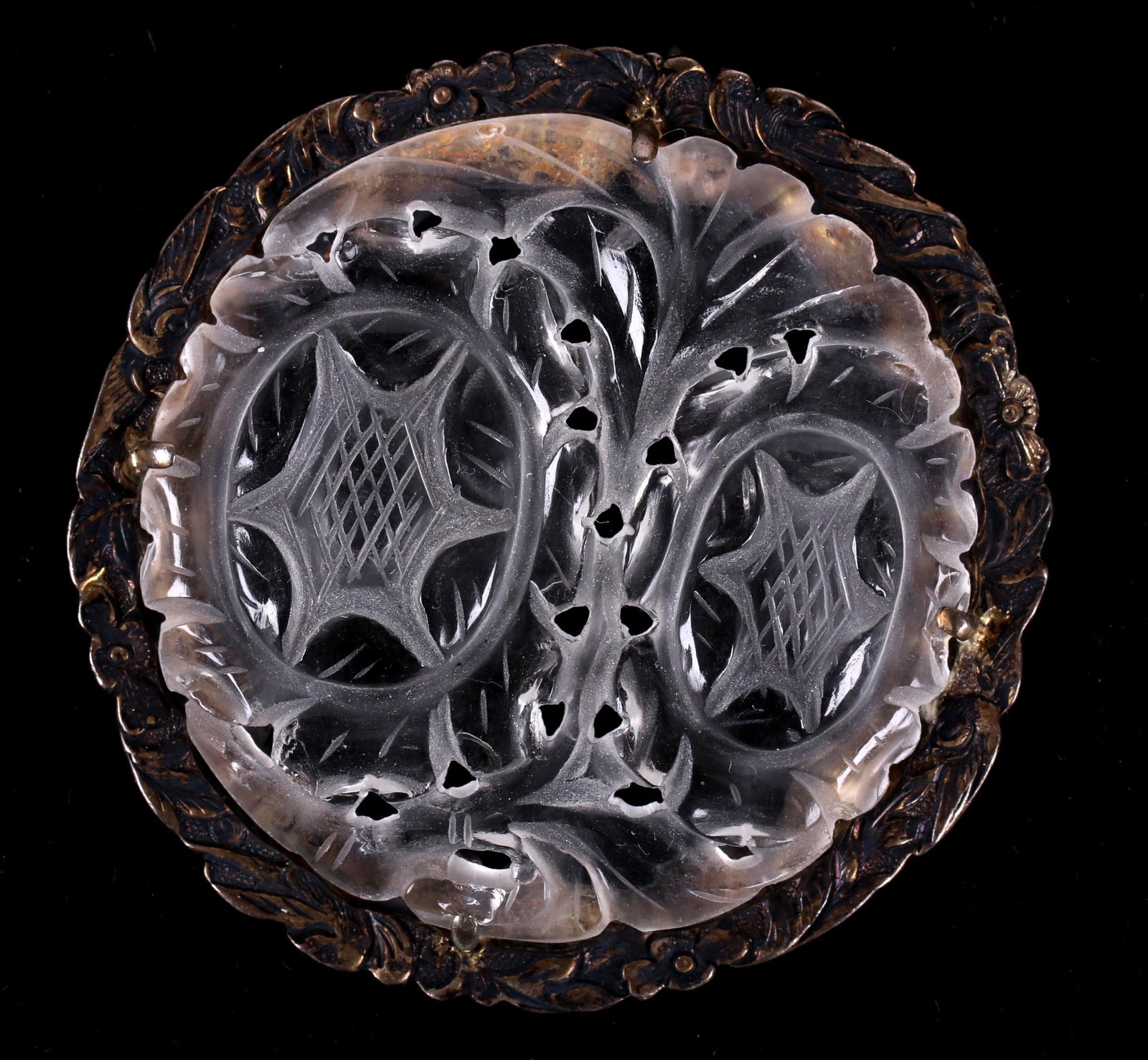 A Chinese Rock Crystal and Silver Pendant: Late 19th century, circular, with an engraved silver frame and a well carved body, marked as pictured. Dimensions: 2" in diameter. Provenance: From a Philadelphia collection.