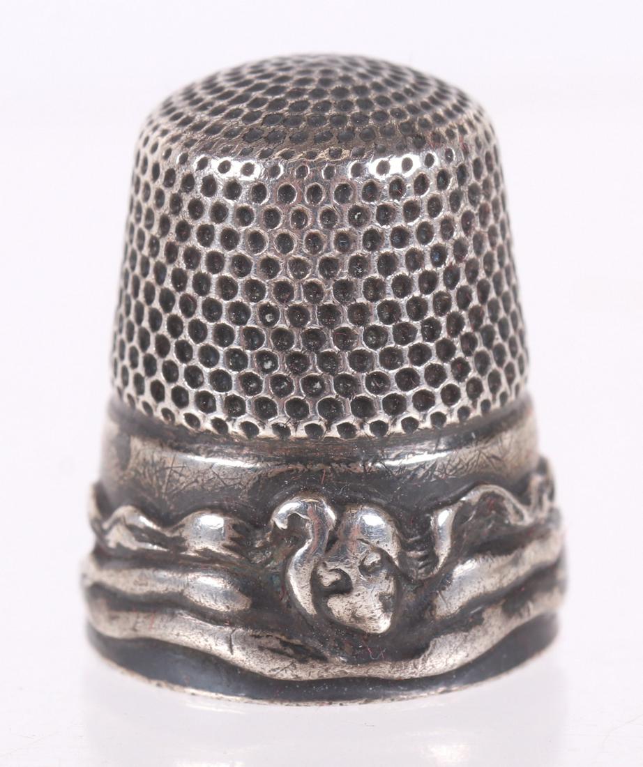 Rare Sterling Silver Art Nouveau Thimble: Circa 1900, by Stern Bros. Known as the 'femme-fleur' or swimmer, thimble. Dimensions: 0.21 troy ounces. Provenance: From a local estate.