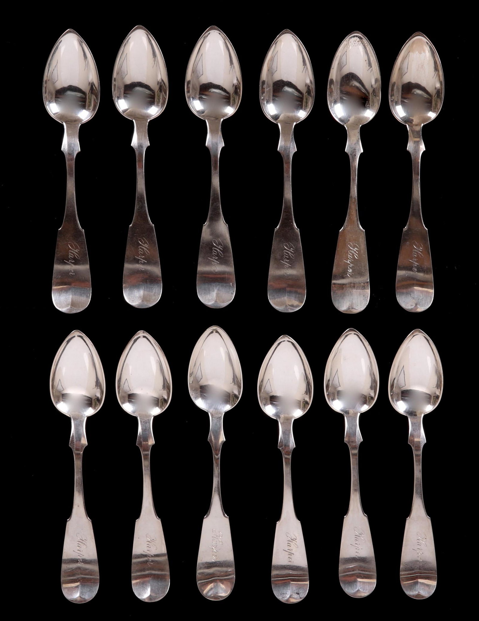 A Set of Twelve Coin Silver Teaspoons: By Henry Harper, Philadelphia, circa 1860. Each terminal engraved, "Harper". Dimensions: Each is 6" long, the approximate weight is 7.9 troy ounces.