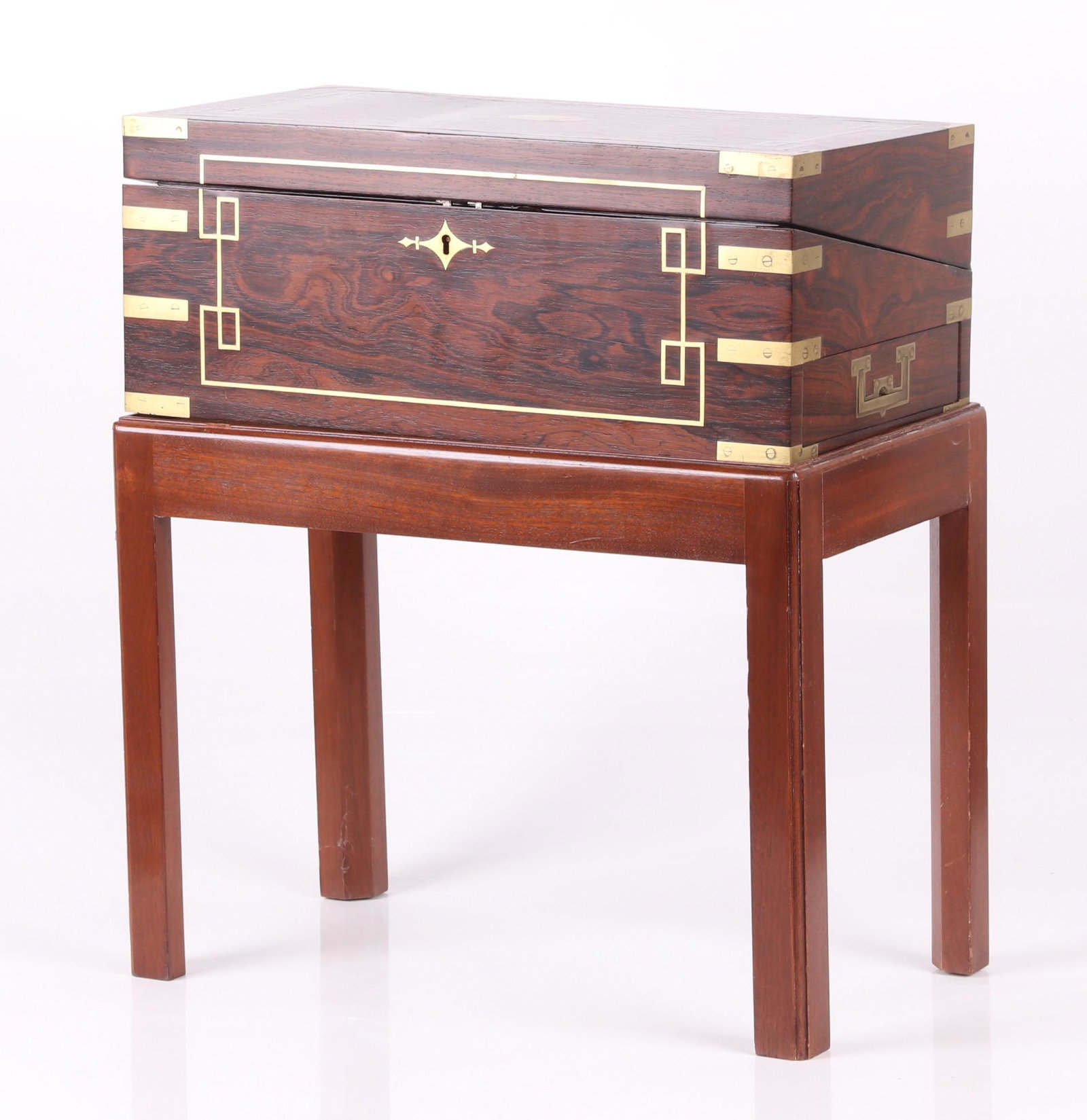 An English Rosewood Lap Desk: 19th century, brass bound with felt covered interior writing surface, pen tray and spaces for inkwells. On a later stand. Dimensions: The lap desk is 20" x 10 1/2" x 8", the overall height is 23 1/4".