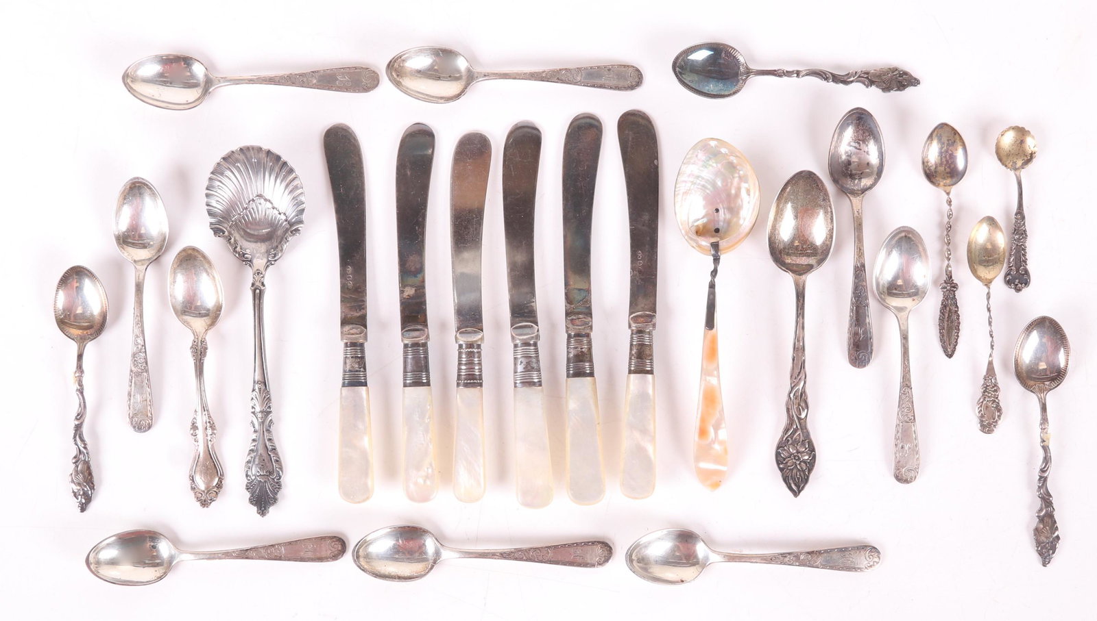 Silver Flatware, Demitasse Spoons, Etc...: Comprising: a silver plated sugar shell marked for Rogers and Hamilton, a mother of pearl spoon (the shaft and bowl are joined by silver), a set of six mother of pearl handled butter knives with silve