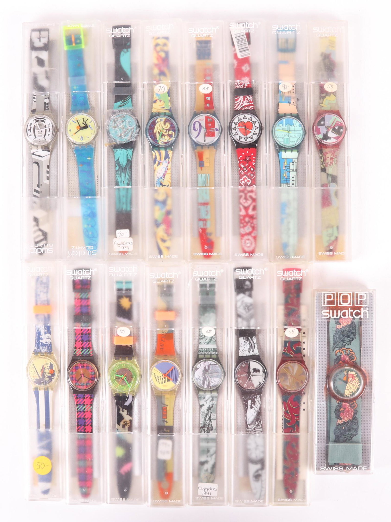 A Group of Swatch Swiss Watches: Fifteen watches with original cases. Dimensions: 14 of the cases measure 9 1/2" x 1 1/2" x 1/2". The other case measures 7" x 2 1/2" x 3/4".