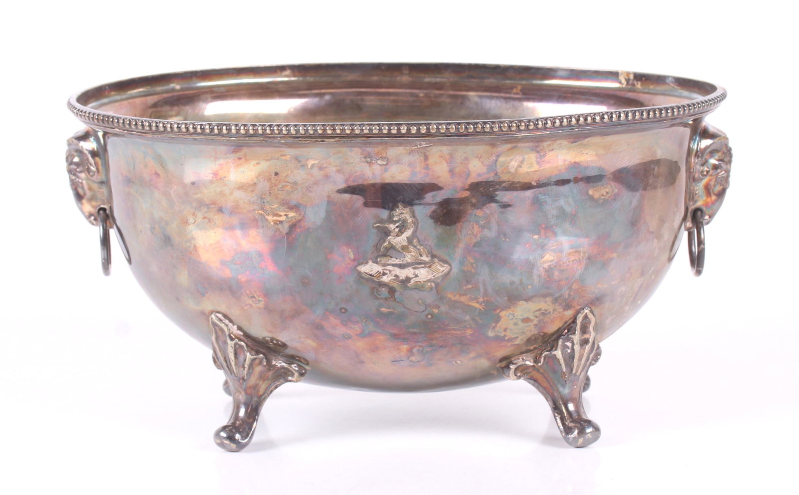 An Old Sheffield Plate Tureen: An early 19th century tureen body (no lid), it features rams head handles and four scrolled legs. Dimensions: 12" x 9 1/4", the height is 6 1/4". Provenance: From a Philadelphia collection.