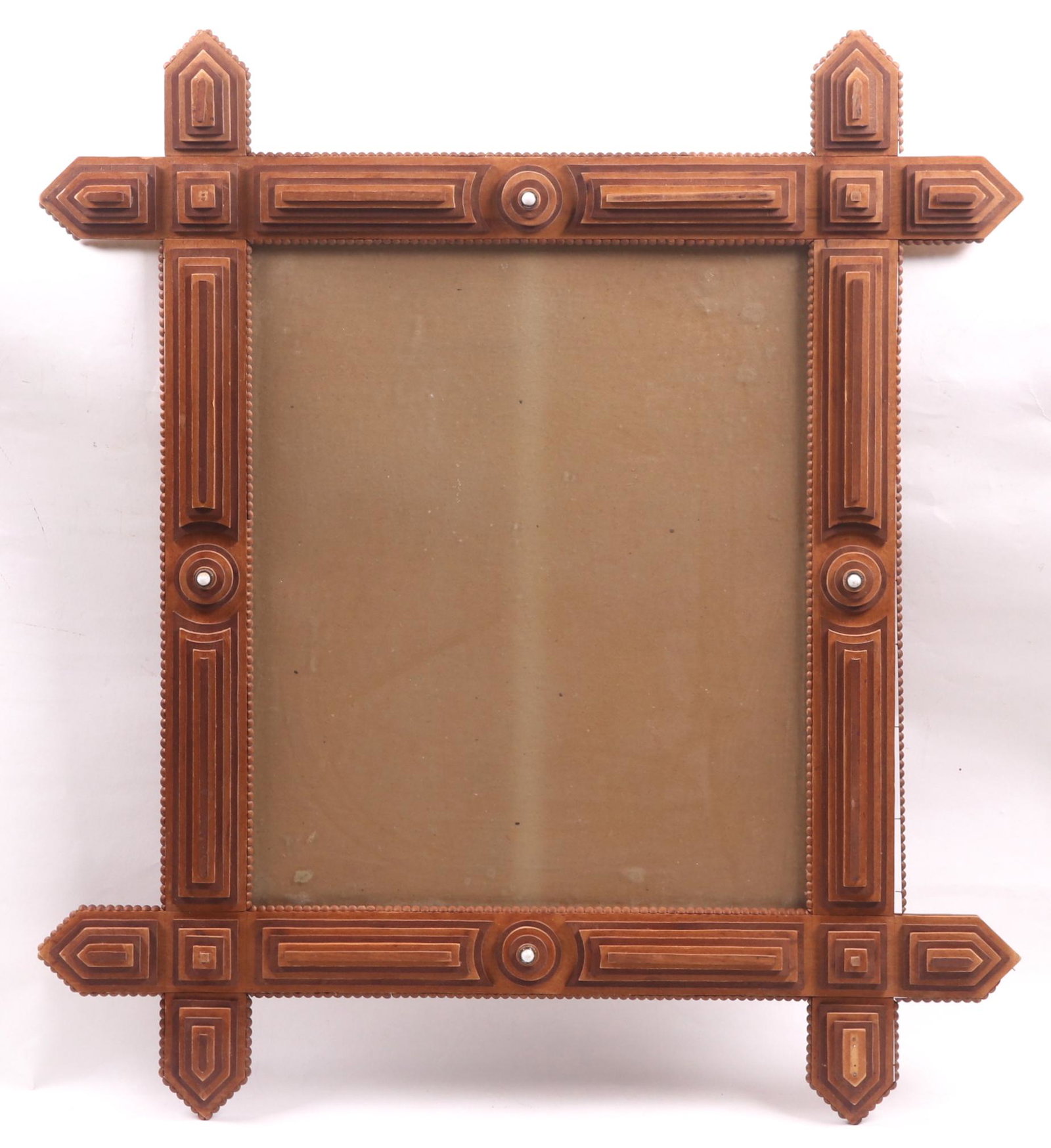 A Tramp Art Mirror: 20th century, rectangular and with four small porcelain accents. Dimensions: 35 1/2" x 32". Provenance: From a New Jersey collection.