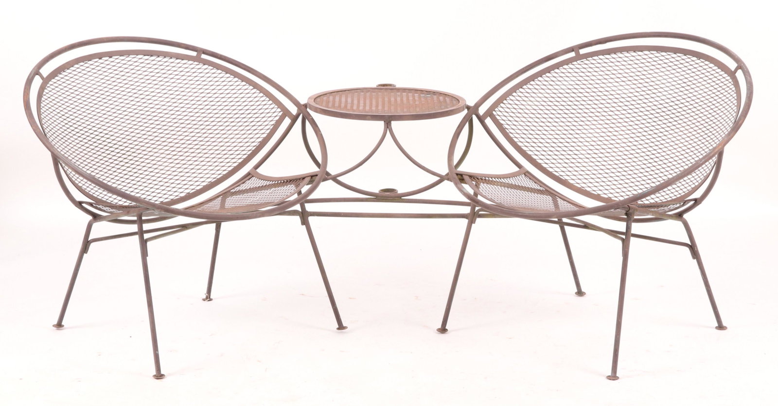 Salterini Wrought Iron Tete-a-Tete: Mauriuzio Tempastini for Salterini. With button feet, circular frames and integrated central table. Dimensions: 69" x 36". Overall height is 28". Provenance: From a Philadelphia collection.