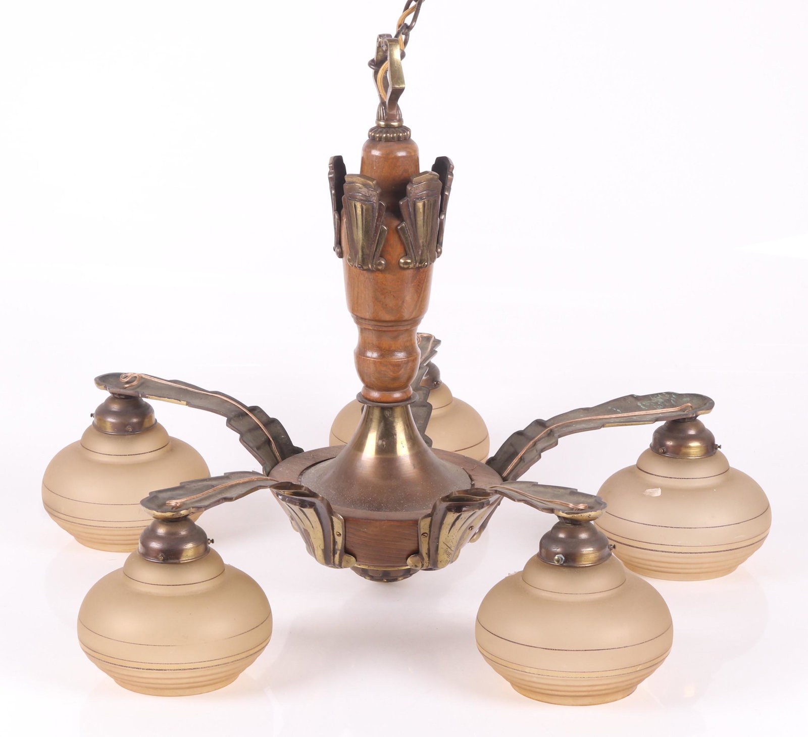 An Art Deco Period Lighting Fixture: French, turned wood with applied brass arms and decorative elements, the shades appear to be original Dimensions: 30" in diameter, the height is 23". Provenance: From a Bucks County Collection.