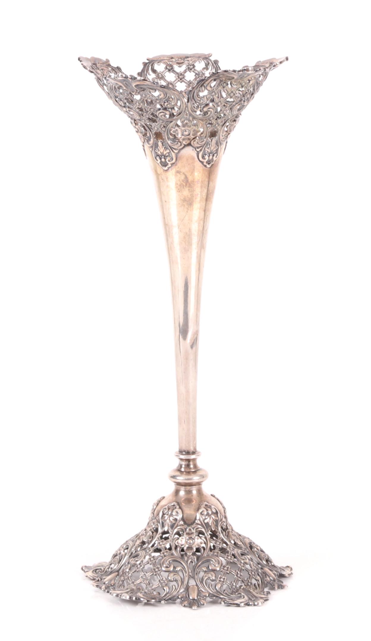 A Sterling Trumpet Vase by Redlich: Circa 1900, with openwork Rococo decoration, marked as pictured. Dimensions: The diameter is 5" , the height is 12 1/4", the approximate weight is 10 troy ounces. Provenance: From a local collection.