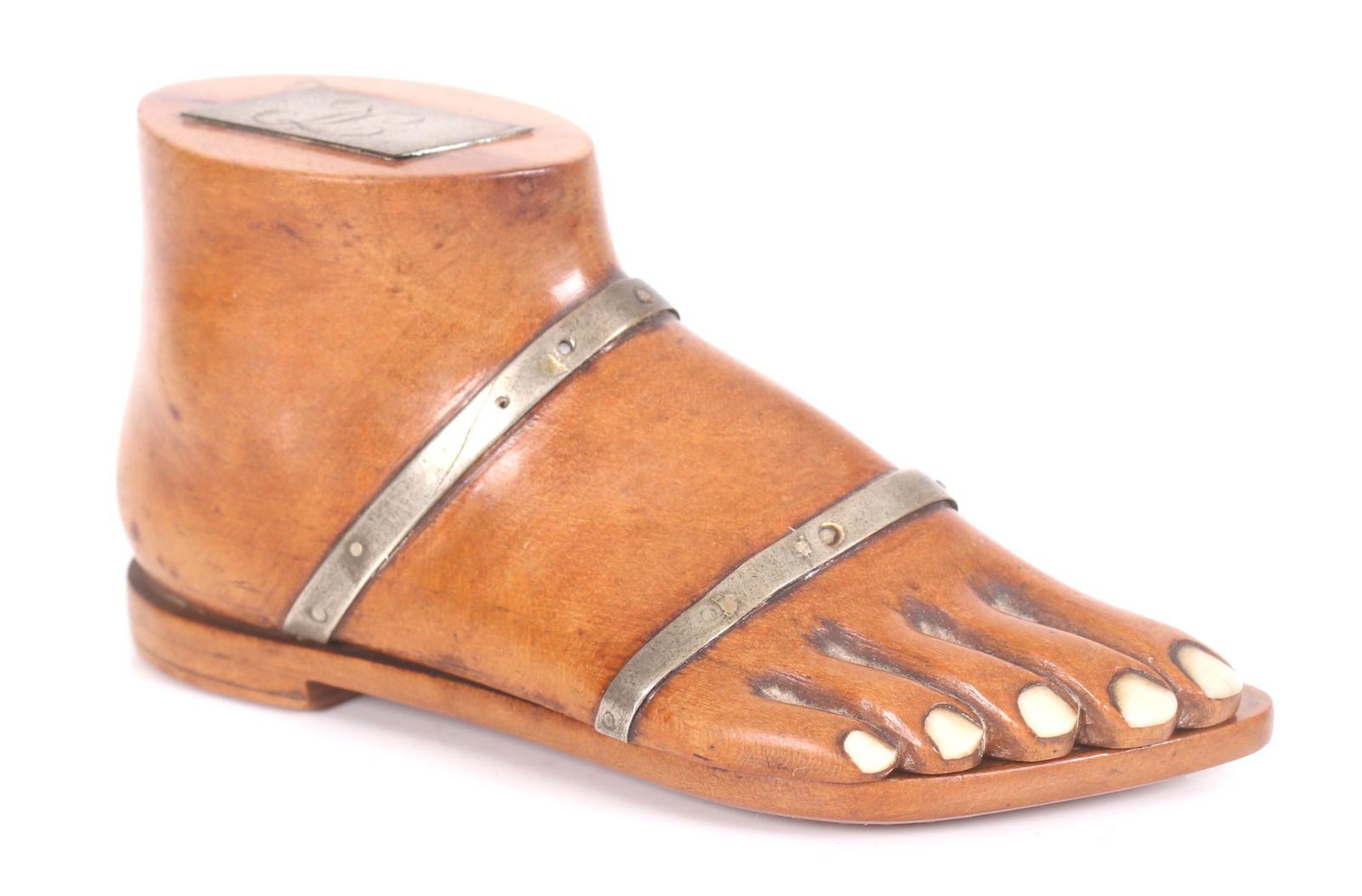 An Unusual Foot Form Wooden Snuff Box: A circa 1840 example in the form of a footwear a sandal decorated with pique work. The toenails are inlaid bone. Dimensions: 3 1/2" x 1 1/4" and 1 3/4" tall.