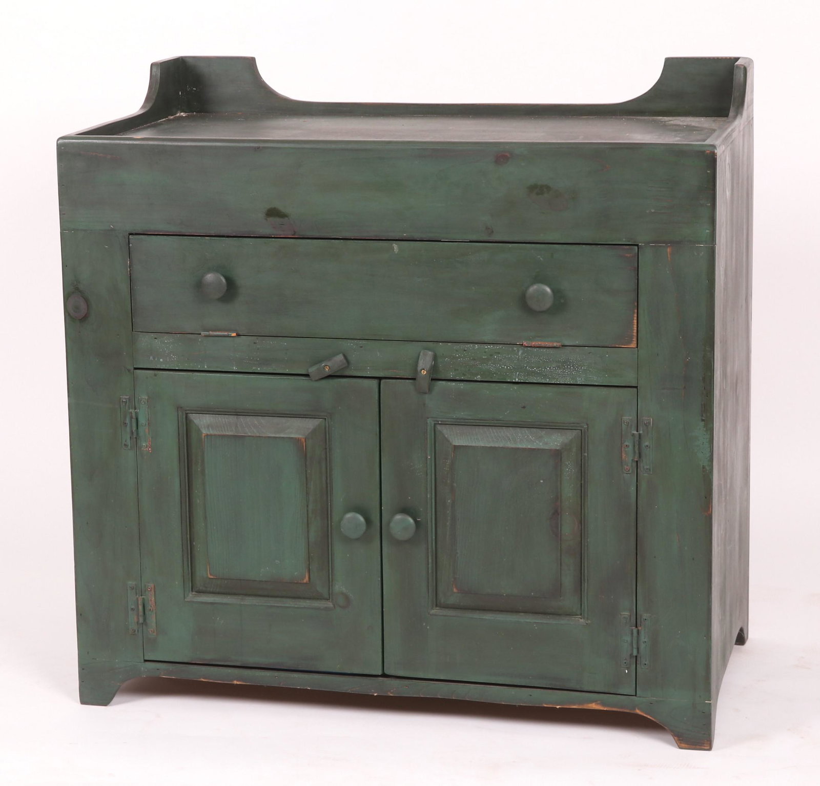 A Modern Green Painted Dry Sink: Having a faux drawer above two panel doors and bracket feet Dimensions: Measures 36" " W x 20" D. Overall height is 35.5". Provenance: From a Philadelphia collection.