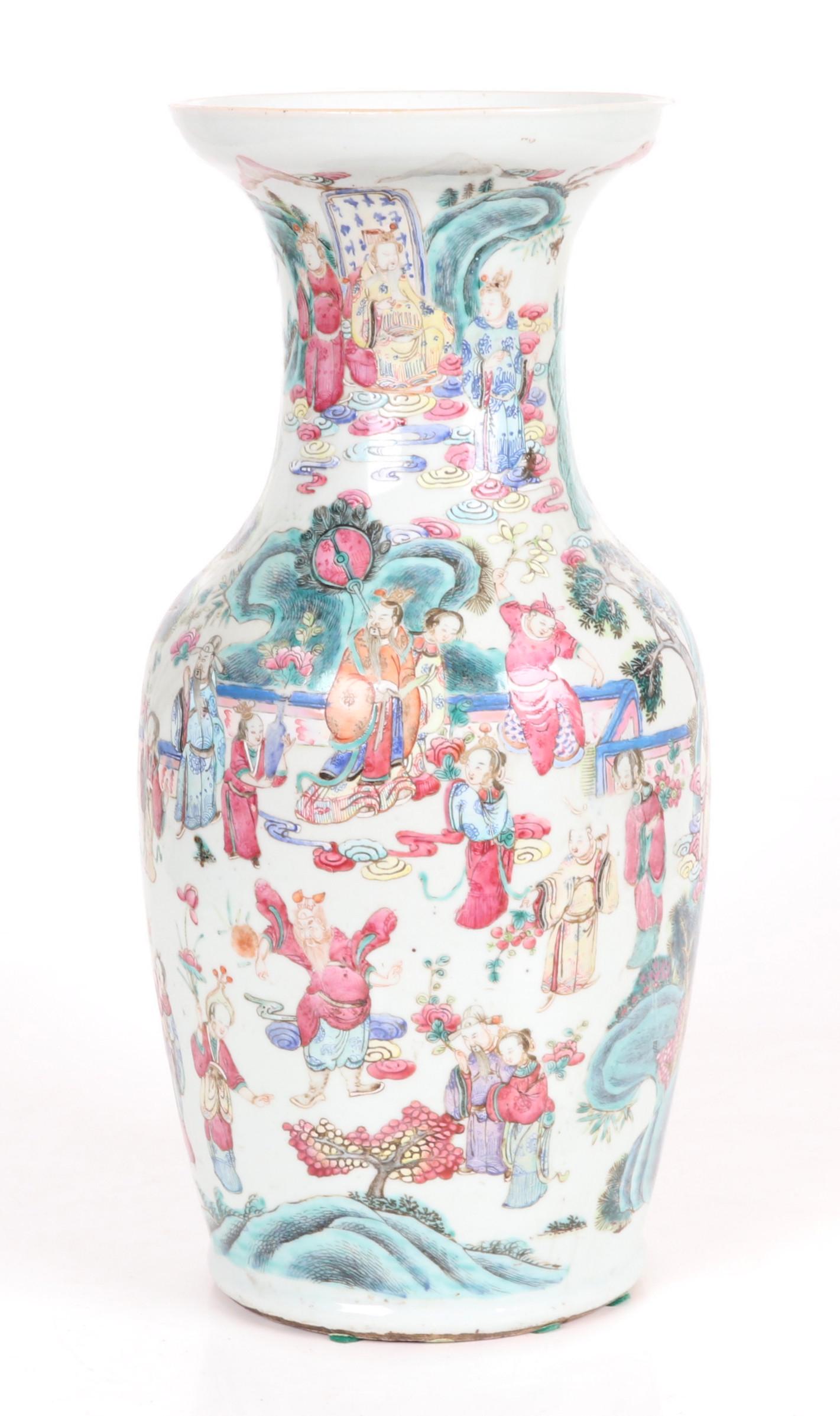 A Chinese Famille Rose Vase, Qing: Baluster form with hand painted decoration that depicts a complicated garden court scene with many figures. Dimensions: 9" in diameter, the height is 18". Provenance: From a Main Line estate.