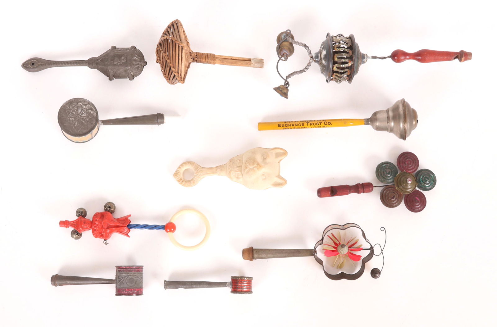 A Group of Baby Rattles, Tin Etc...: Materials include rubber, tin, wood, early plastic and wicker. Dimensions: From 4" to 9" long. Provenance: From a Philadelphia estate.
