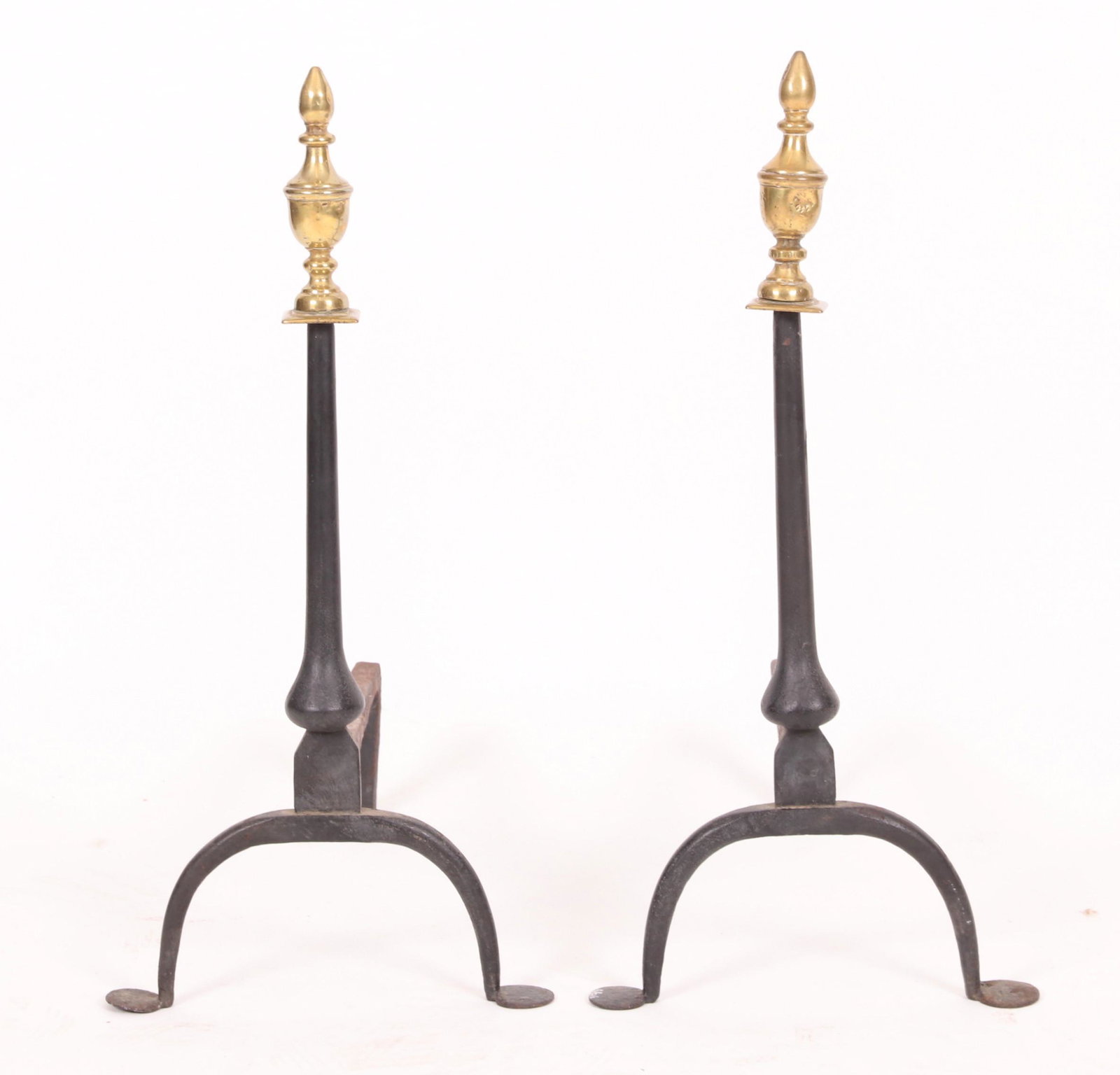 A Pair of 19th Century Federal Andirons: Having brass tops and wrought iron bodies, Dimensions: 24" H x 11" W x 17" D Provenance: From a Pennsylvania Estate