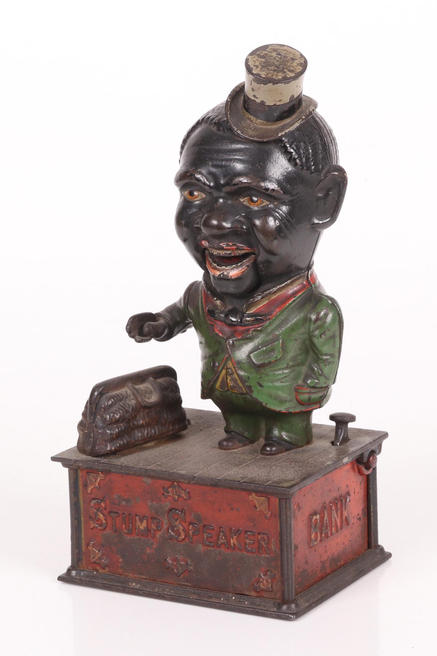 Cast Iron Mechanical Coin Bank, Stump Speaker: A Black Americana cast iron mechanical "Stump Speaker" coin bank, late 19th century. Dimensions: 10" H x 5" W x 4" D.