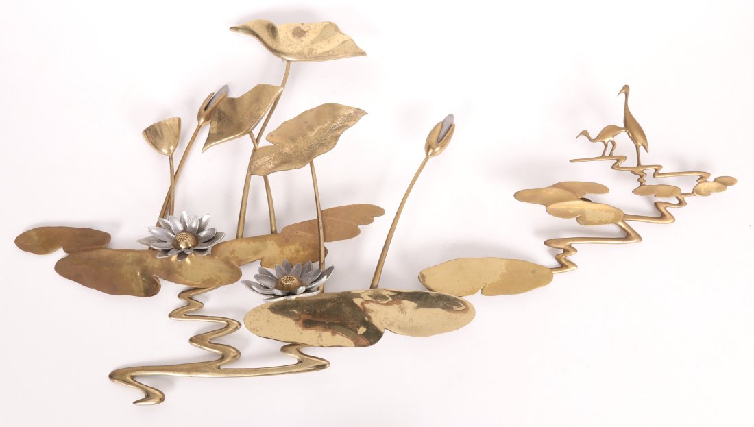 A Mid Century Brass Wall Hanging, Bahar Bijan: A cast brass wall hanging of lily pads and birds,. Signed and dated 1987. Dimensions: 20.5" H x 38" W x 2.5" D Provenance: From a Philadelphia estate.