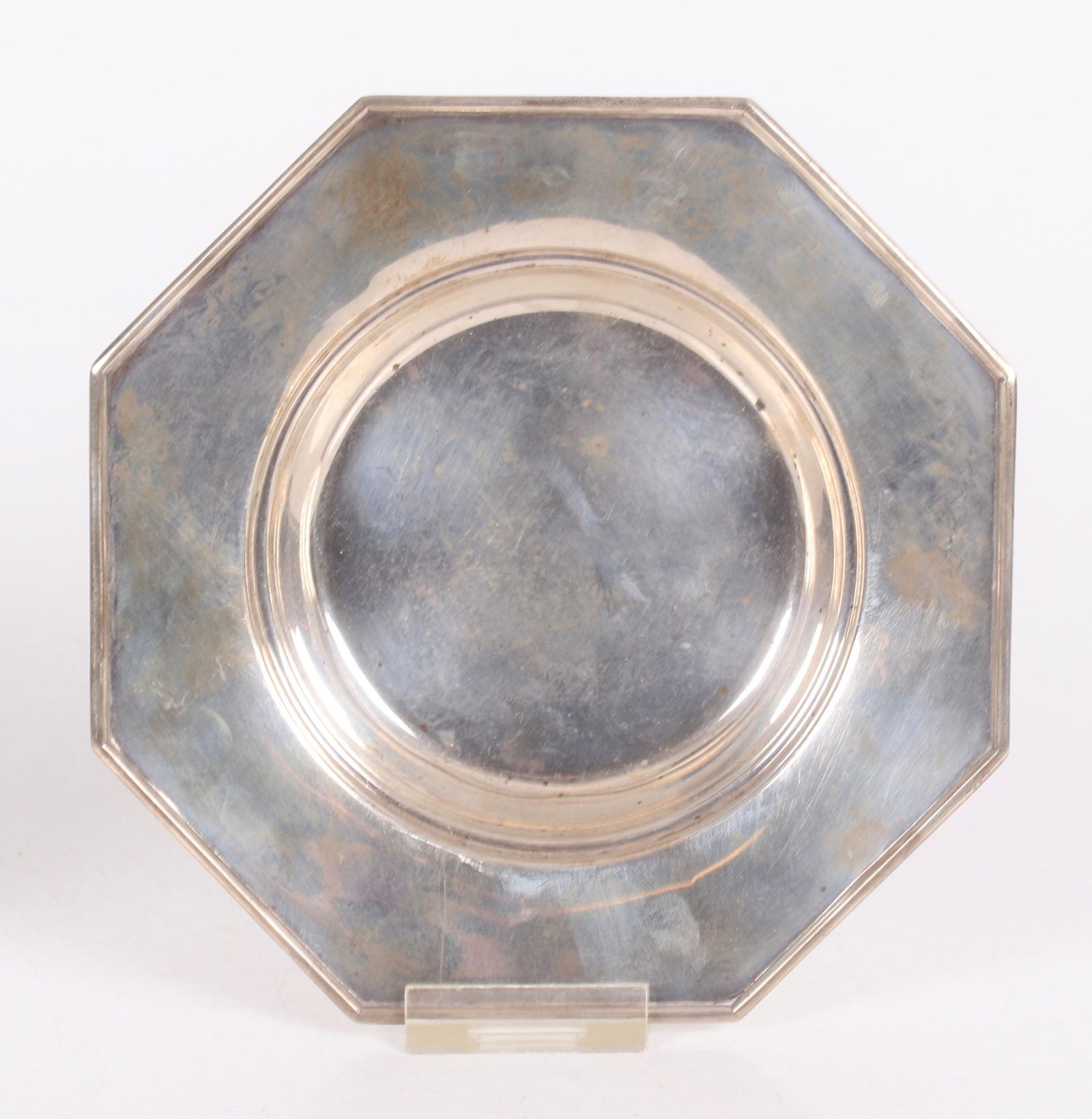 Two Sterling Silver Table Items: An oblong molded tray and an octagonal wine bottle coaster marked for J.E. Caldwell. Dimensions:The tray is 9 1/2" x 6", the coaster is 6" in diameter, the approximate combined weight is 7.8 troy ounc