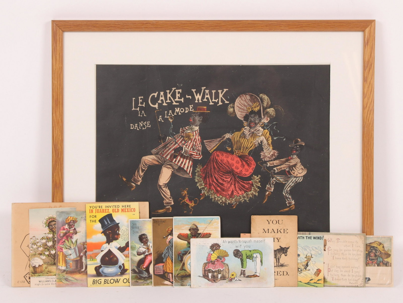 A Group of Black Americana Ephemera: Ten postcards, a "Komic Kard" and a framed lithograph titled, "Le Cake -Walk a la mode, La Danse". Dimensions:The framed print is 17" x 21". Provenance: