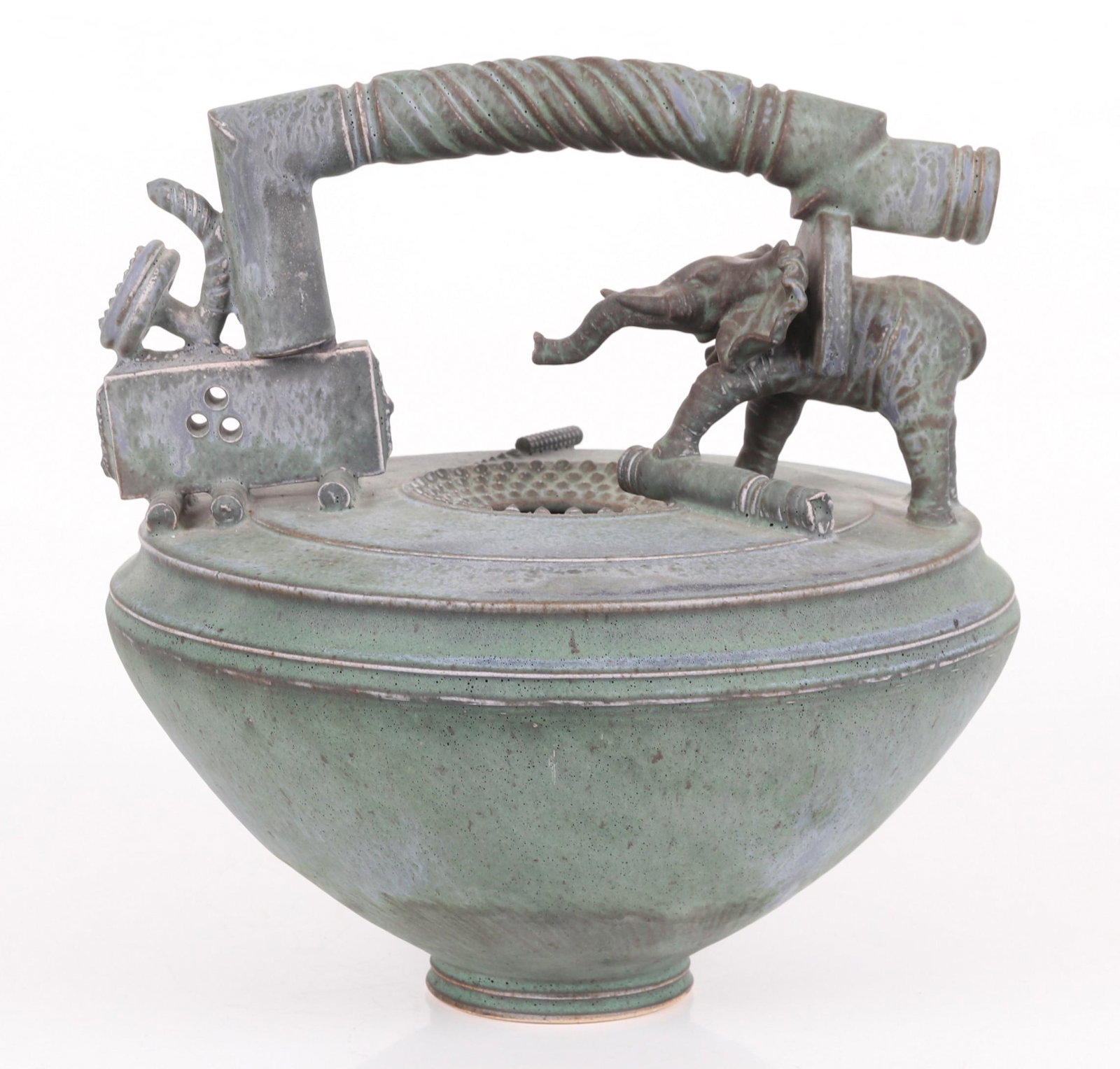 A Tim Mather Art Pottery Vessel: From the second half of the 20th century, with an elephant that supports the handle, marked as pictured. Dimensions:11 1/2" in diameter, the height is 11". Provenance:From a Main Line estate.